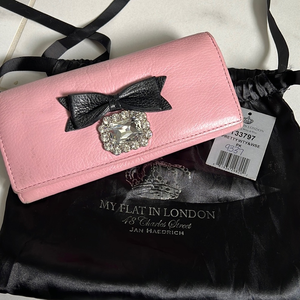 Well loved My Flat in London wallet. It can be cleaned up with leather cleaner.